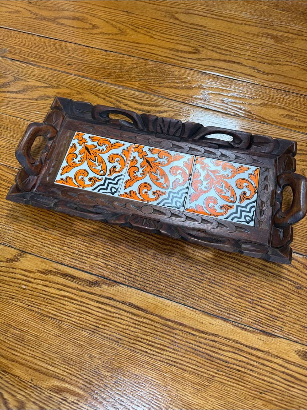 Vintage Mexican serving tray. Dark hand carved wood tray with orange/black tile.